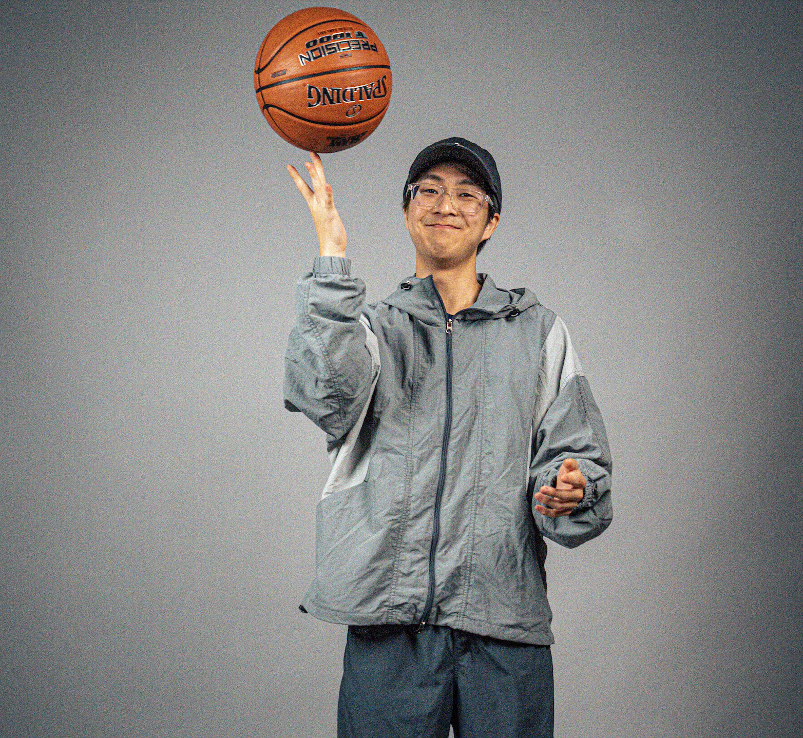 Josh Lee balances a basketball on his finger